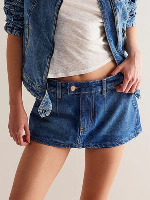 Denim mini skort in dark blue with button closure and casual styling.