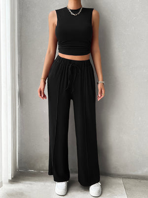 Black ribbed crop top and wide-leg lounge pants with drawstring waist and front seam detail.