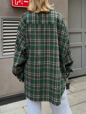 Plaid pocketed button-up shacket in dark green with button cuffs.