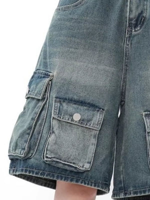 Men's light wash denim cargo shorts with multiple button-flap pockets.