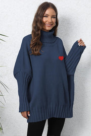 Dark Blue batwing knit turtleneck sweater with red heart embroidery and ribbed sleeves.