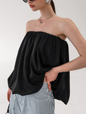 Black strapless bubble hem top with a cinched neckline and flowy silhouette.
