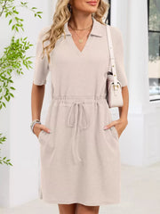 Apricot textured polo dress with short sleeves, V-neck, drawstring waist, and pockets.