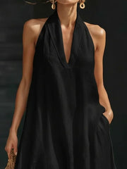 Black halter neck maxi dress with pockets in cotton linen fabric.