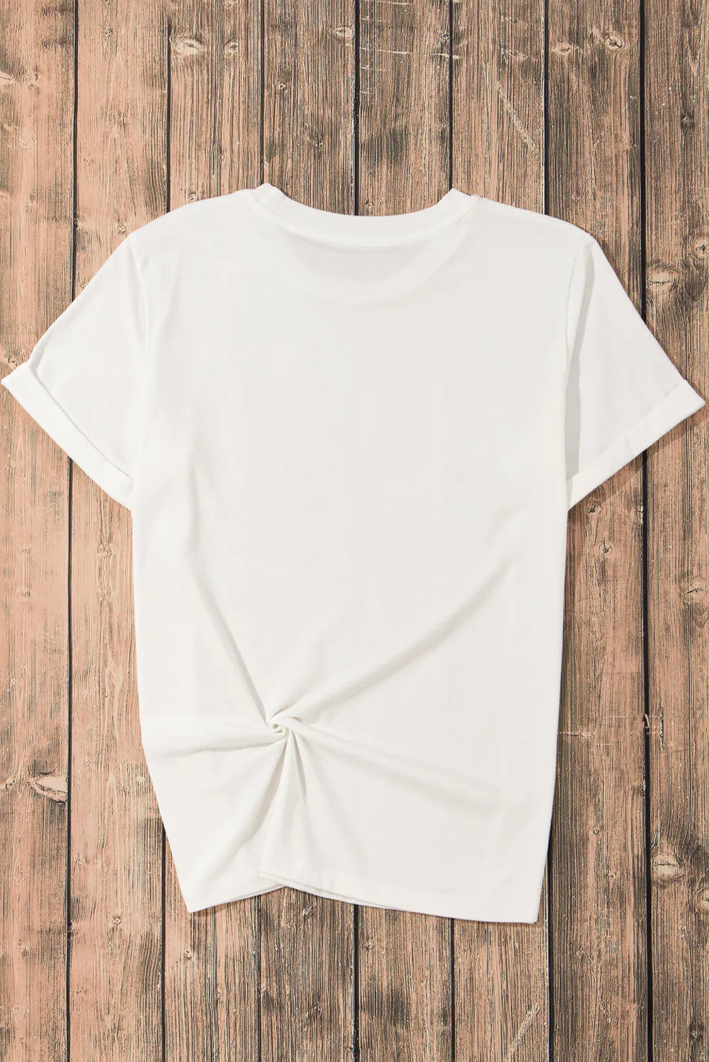 White graphic t-shirt with rolled sleeves and a knotted hem detail.