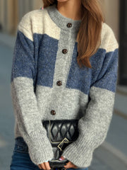 Colorblock crewneck button-down knit cardigan in blue, gray, and beige acrylic with button details.