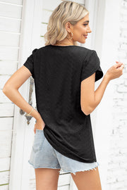 Black eyelet detail flutter sleeve blouse with textured fabric.