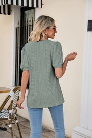 Sage perforated puff sleeve v-neck top with eyelet details.
