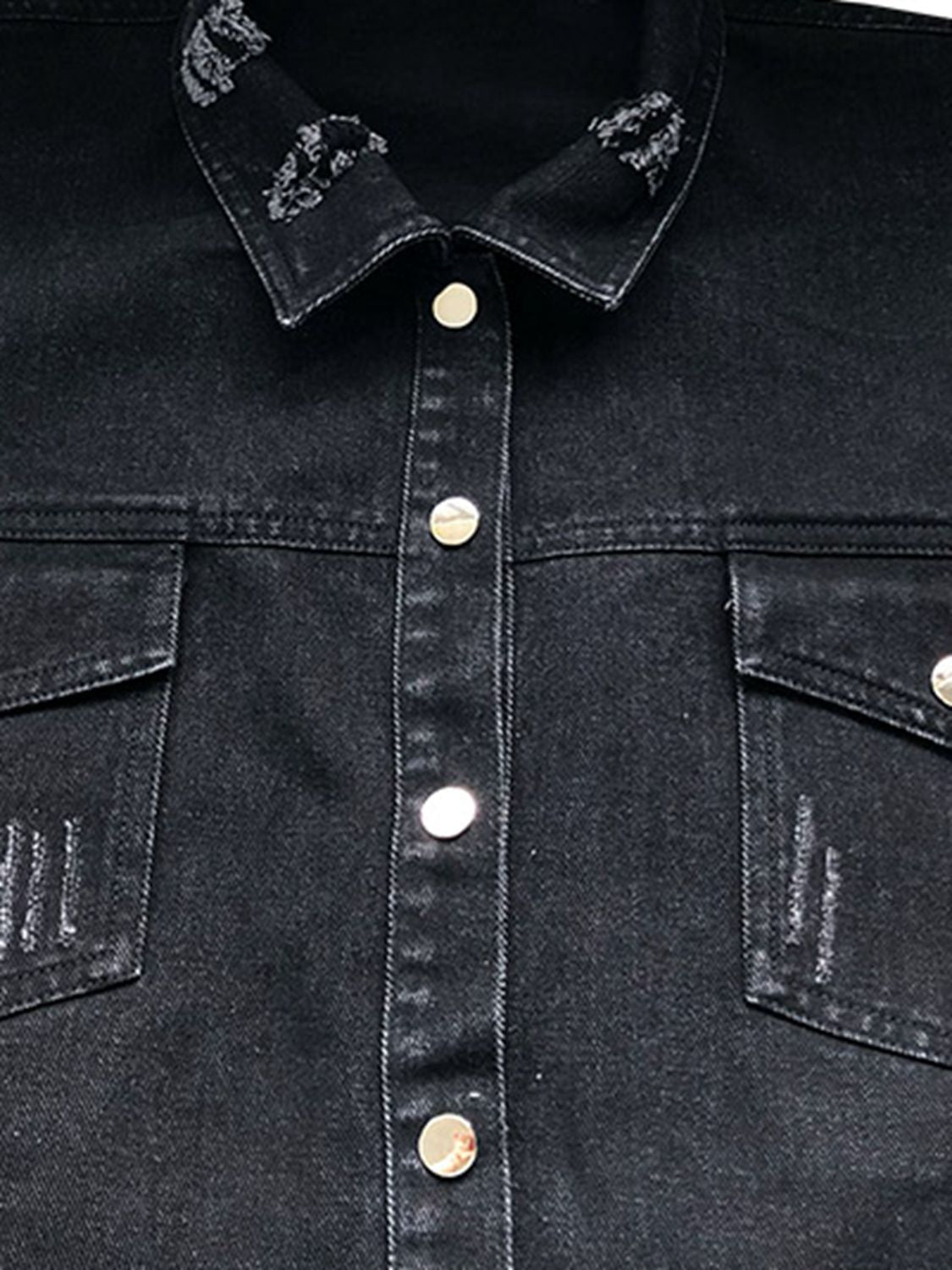 Black denim shirtdress with distressed collar and pocket details.
