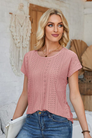 Perforated eyelet cuff tee in blush pink with short sleeves and a crew neck.