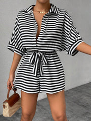 Black and white striped shirt romper with self-tie belt and button front.