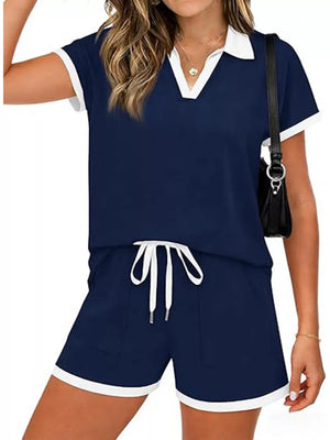 Navy blue polo collar two-piece set with white trim and drawstring shorts.
