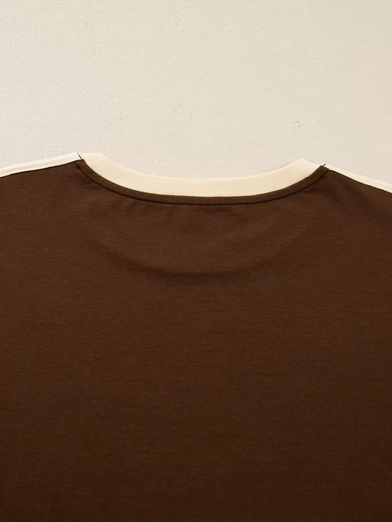 Dark brown long-sleeve t-shirt with cream contrast crew neck and trim