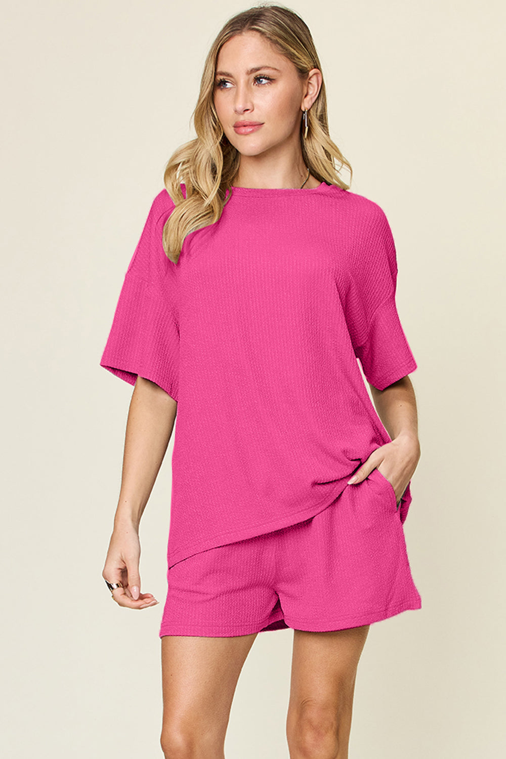 Waffle knit boxy tee and shorts set in hot pink with crew neck and short sleeves.