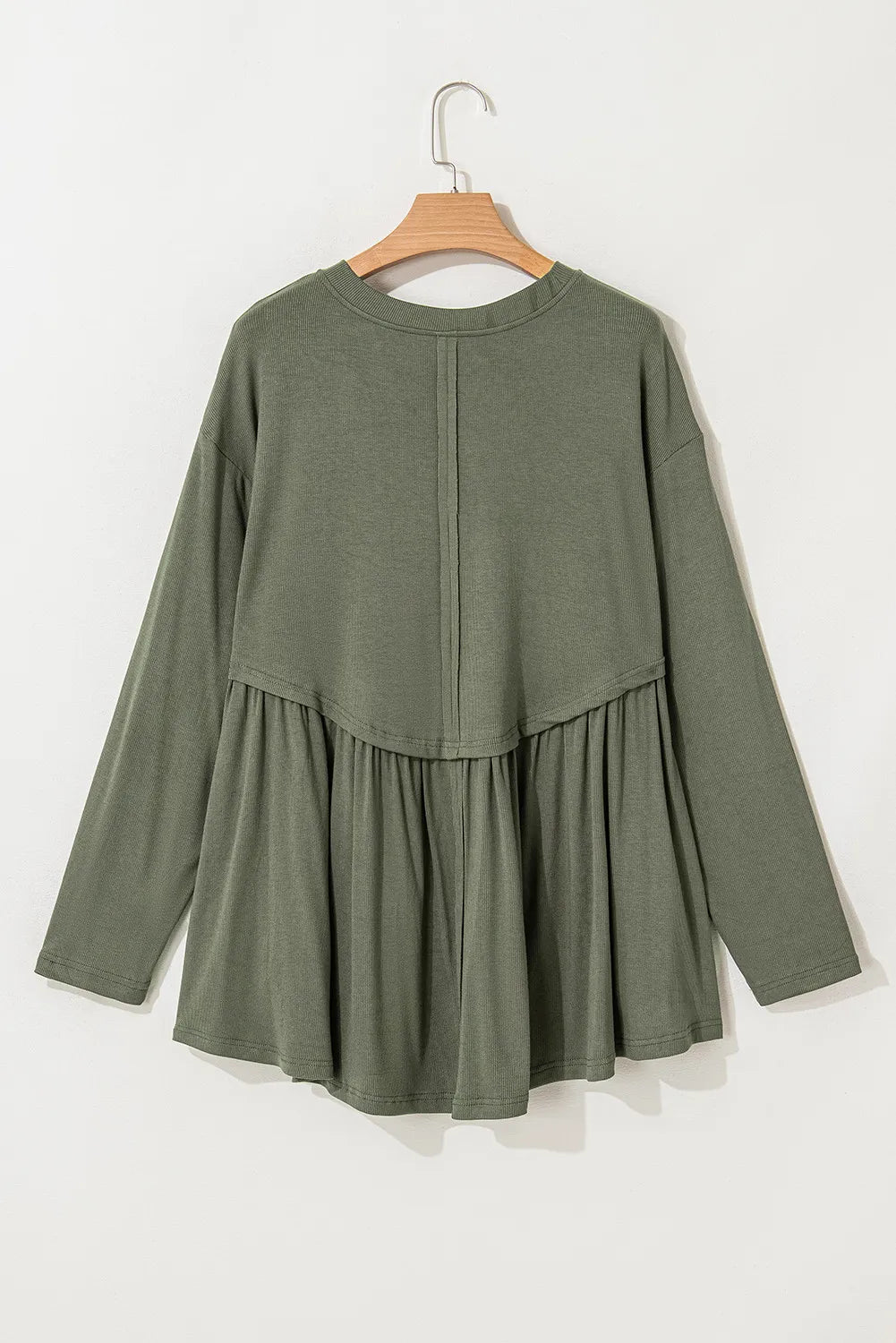 Moss ribbed peplum blouse with long sleeves and a yoke detail.