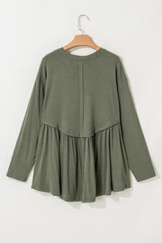 Moss ribbed peplum blouse with long sleeves and a yoke detail.