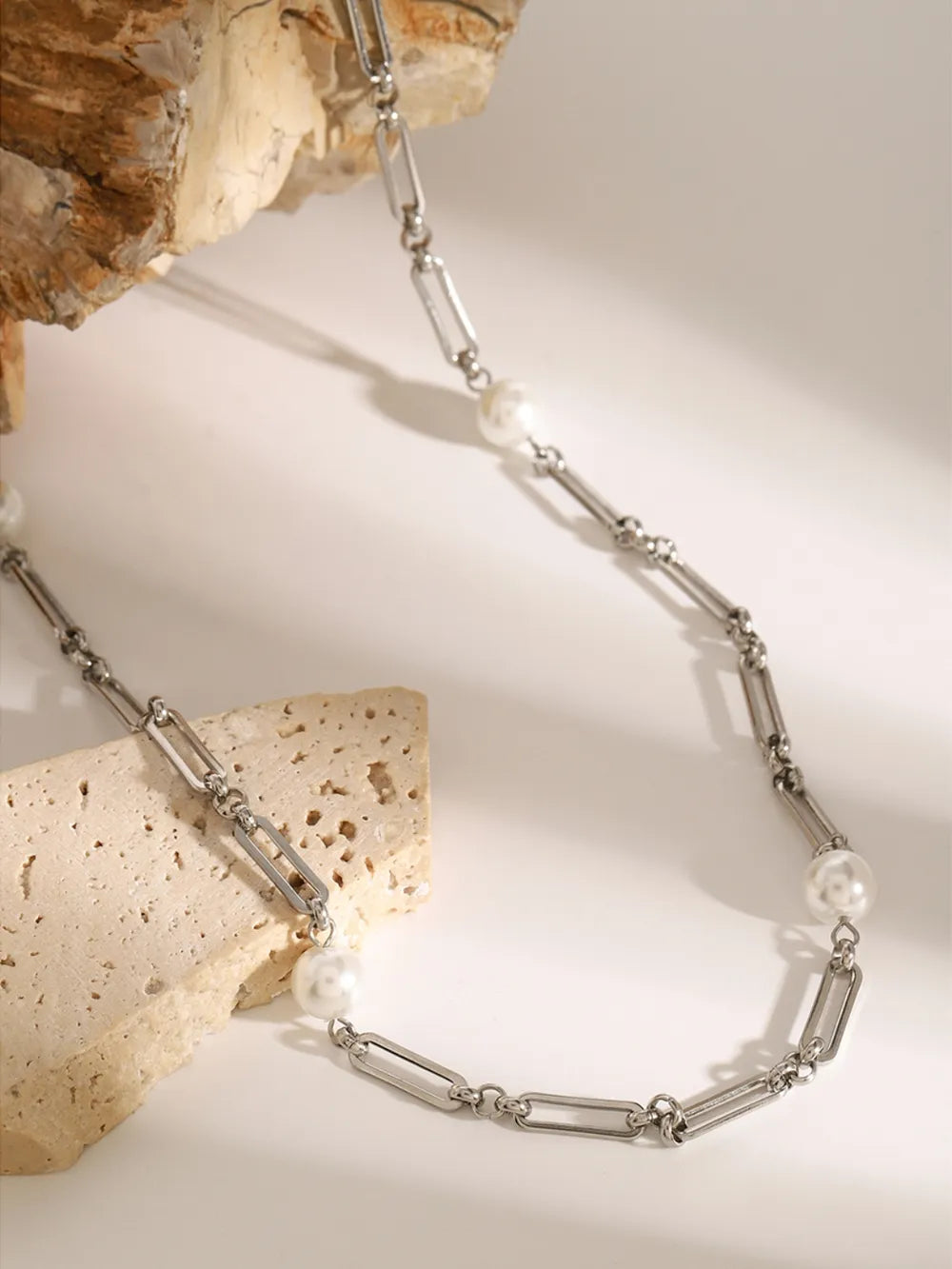 Silver two-tone pearl link necklace with alternating chain and pearl elements.