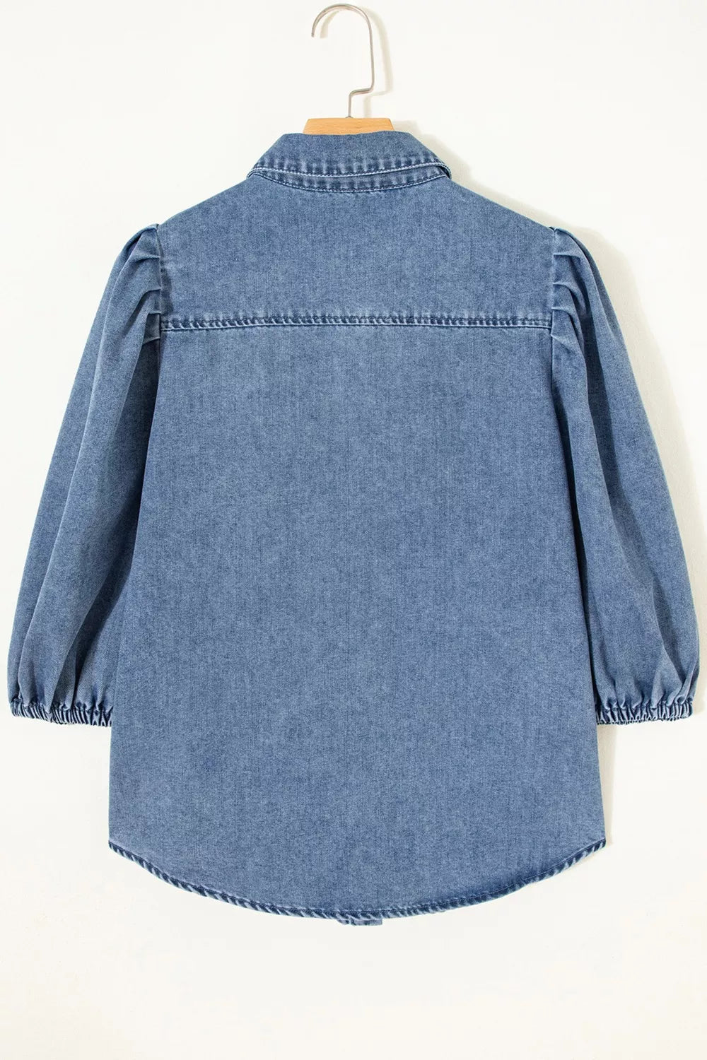 Voluminous puff sleeve denim maternity blouse with collared neckline and button-down front.