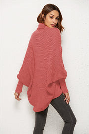 Cocoon knit cardigan in rust with shawl collar and batwing sleeves.