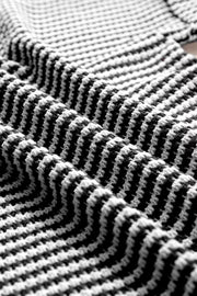 Textured knit t-shirt in black and white with a notched neckline.