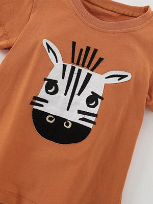 Orange baby tee with a cute zebra face graphic applique.