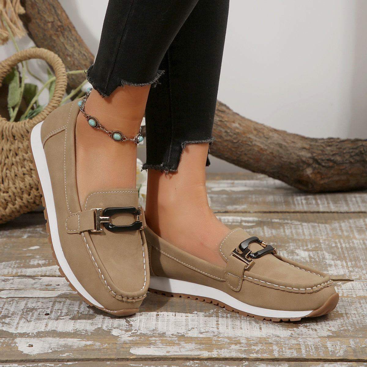 Buckle casual slip-on loafers in khaki with contrast stitching and a gold-tone buckle detail.