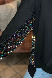 Black sweatshirt with sequin panel detail on sleeve and side slit