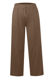 Seamed palazzo lounge trousers in tan with drawstring waist and wide leg.