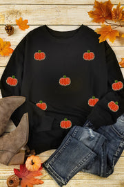Black crewneck sweatshirt with allover embroidered pumpkins, long sleeves, casual autumn style.