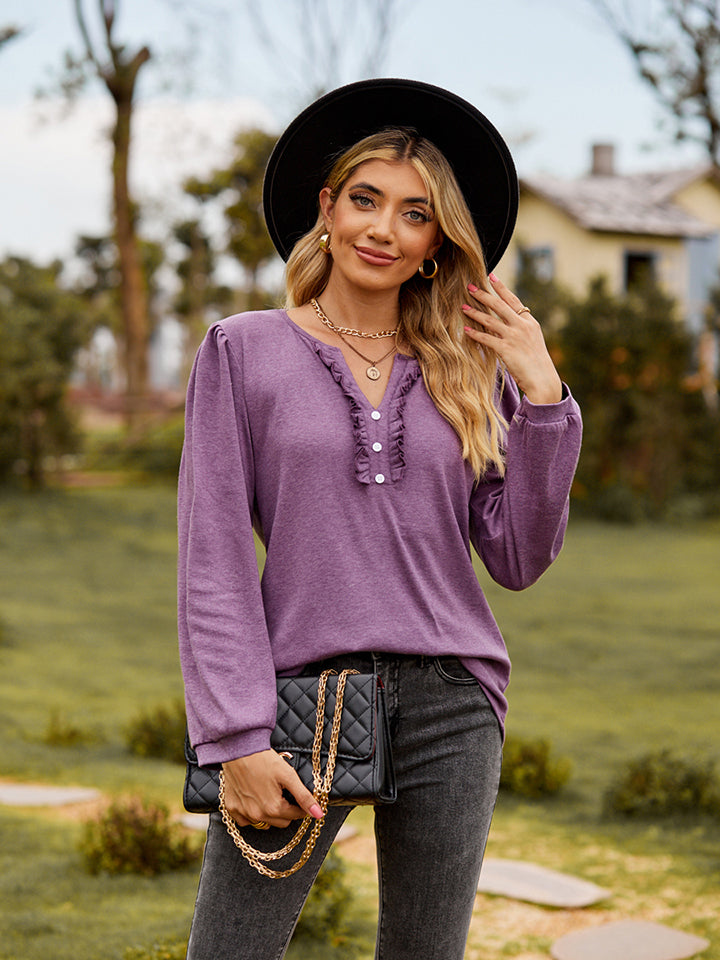 Dusty Purple ruffled henley blouse with button placket and long sleeves.