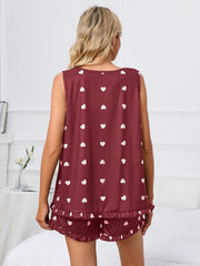 Burgundy heart print loungewear set with ruffle hem shorts and sleeveless top.