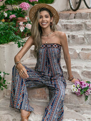 Boho bandeau jumpsuit with wide legs and a navy, orange, and white paisley-inspired print.
