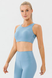 Light blue performance sports bra with racerback and sculpted fit