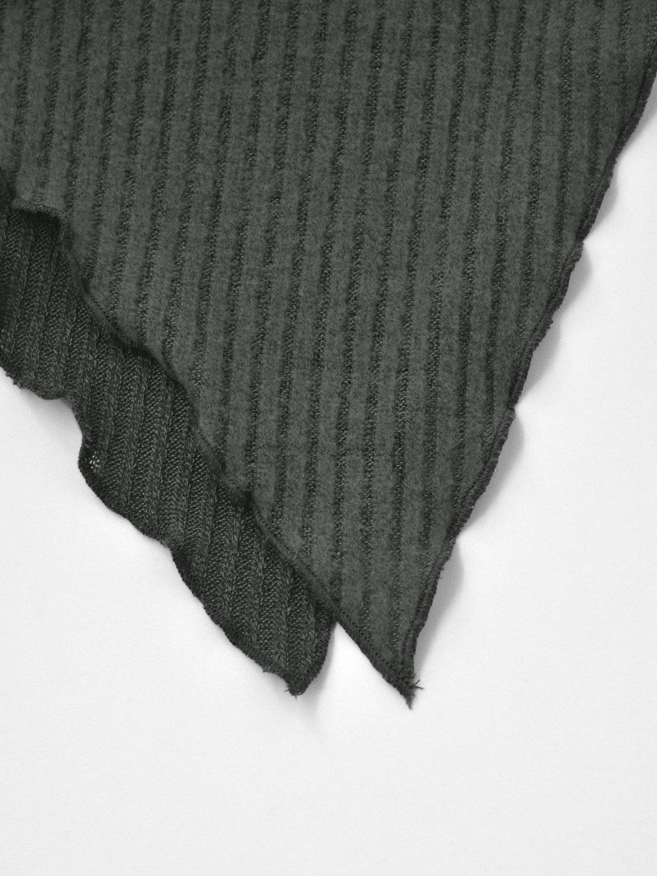 Dark gray ribbed knit top with asymmetrical hem detail