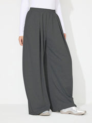 Dark gray pleated drape palazzo trousers with a wide leg and elastic waistband.