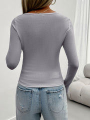 Gray textured knit scoop neck sweater with lace detail, long sleeves.