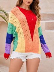Vibrant color-blocked openwork knit sweater with rainbow stripes and a V-neck.