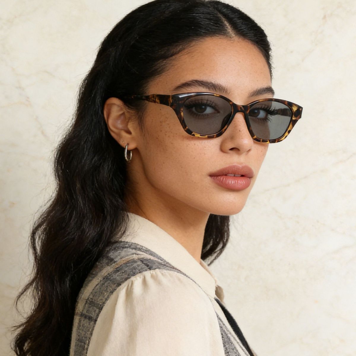 Uv400 acetate cat-eye sunglasses in leopard print with dark lenses.