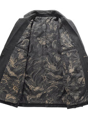Men's black denim blazer with a detailed dragon print lining and button closure.