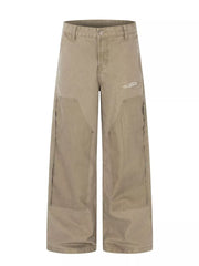 Khaki wide-leg cargo pants with distressed details and deconstructed seams.