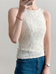 White sheer lace tank top with floral pattern and round neckline.