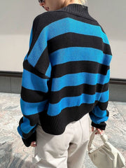 Cropped acrylic knit cardigan with black and blue stripes and a mock neck.