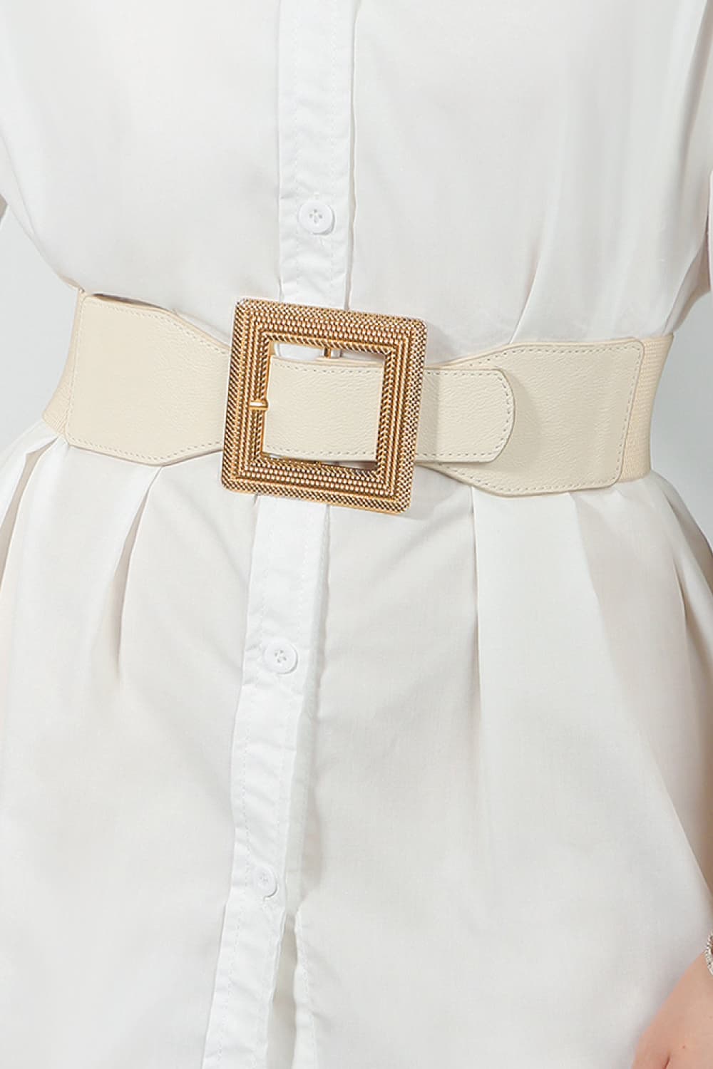 Ivory elasticated waist belt with textured gold square buckle