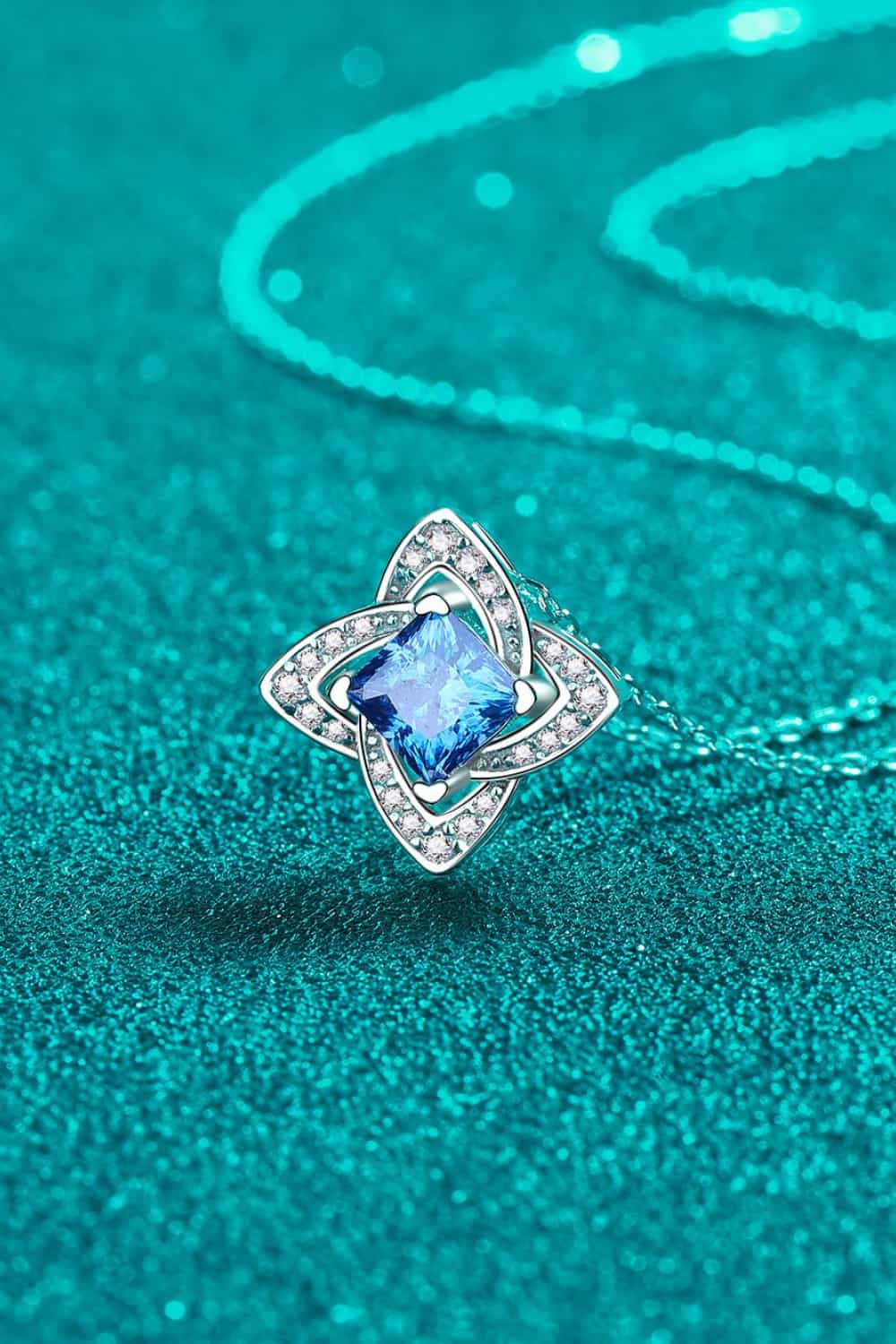 Sky blue moissanite and diamond pendant necklace with floral design