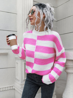 Pink and white striped acrylic sweater with a crew neck and long sleeves.