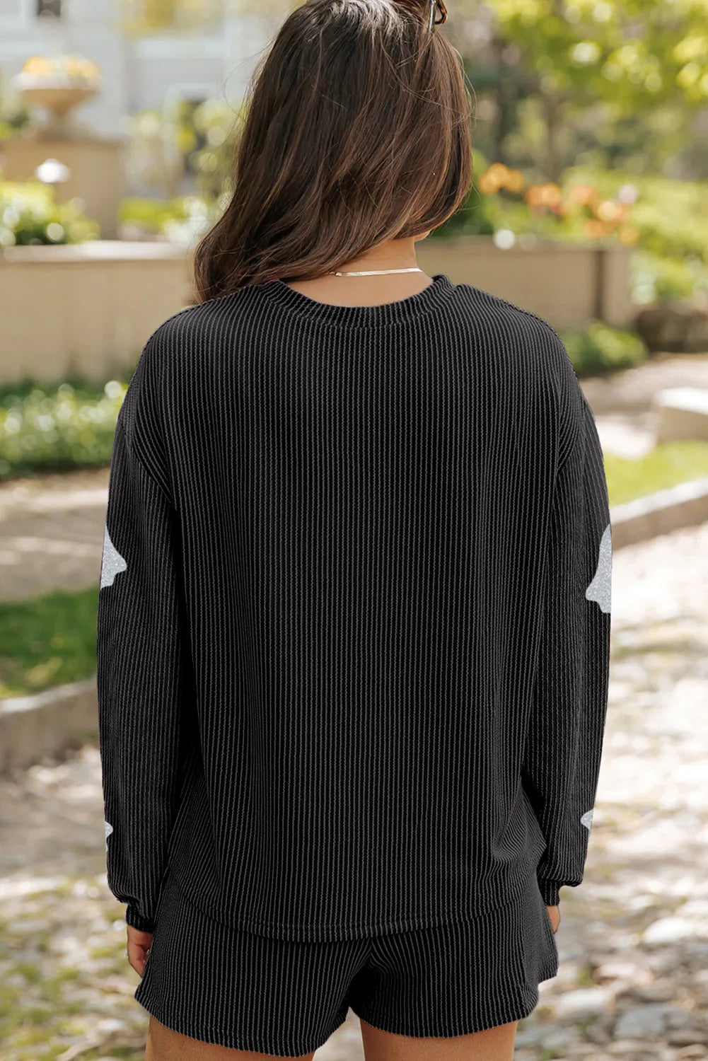 Black glitter ghost loungewear set with ribbed texture and shorts.