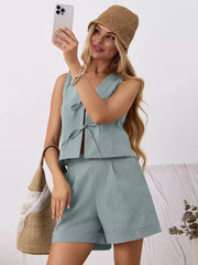 Blue cotton tie-front sleeveless top and pleated shorts set with a V-neck.