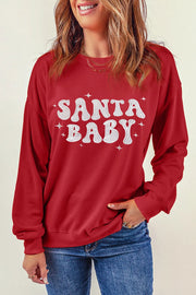 Red crewneck sweatshirt with white Santa Baby graphic and stars, casual long sleeve.