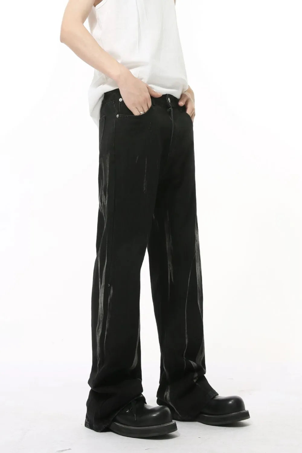 Faded flare denim jeans in dark wash with a relaxed fit and subtle distressed details.