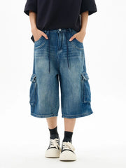 Relaxed fit vintage blue denim cargo shorts with drawstring waist and utility pockets.